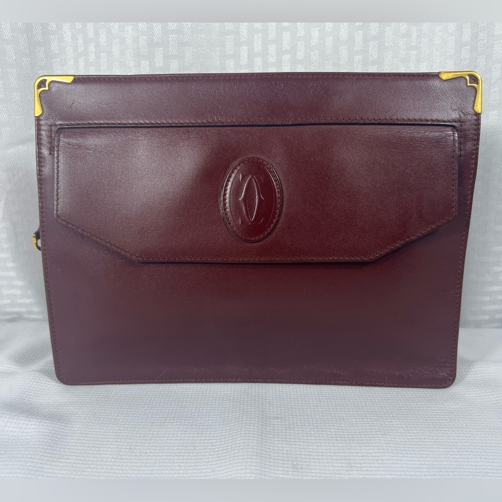 7052: Cartier Must de Cartier Burgundy Leather Clutch Vintage